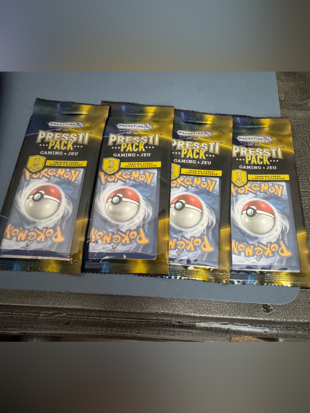 Pokémon Pressti Starter Booster Packs set of 4 with 3 cards in each Blue & Gold
